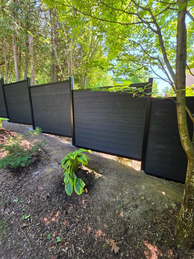 Black composite privacy fence installed by Everline Fence